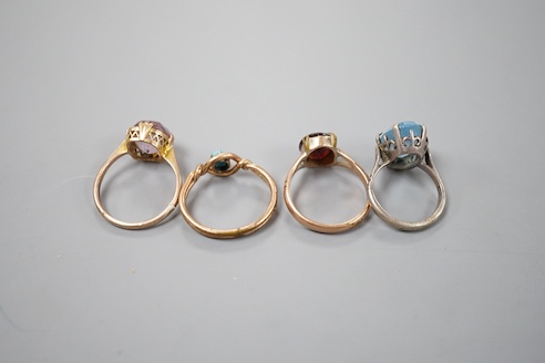 Two 9ct dress rings and two other rings including gilt metal and paste set.